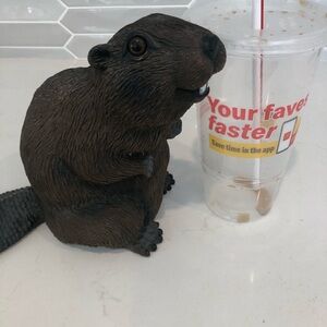 Marmot sculpture with faux drink